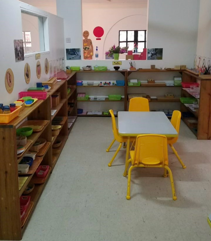 Classroom detail — plants, natural materials, and child-sized furnishings